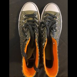 Unisex Leopard print Converse in Army green/black exterior and orange interior.